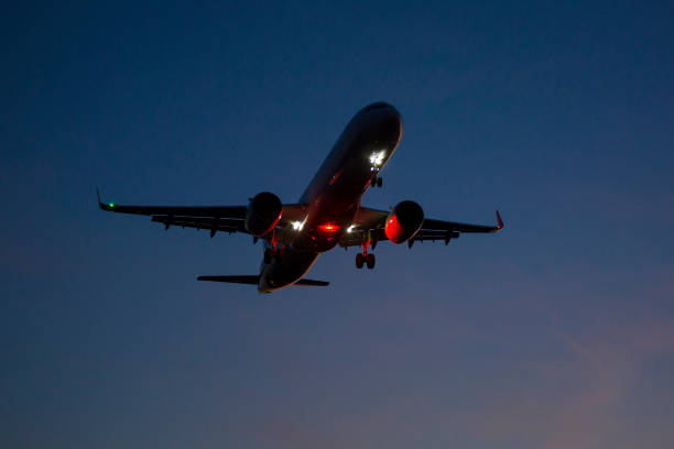 istock Airplane landing approach at dusk 1170179257