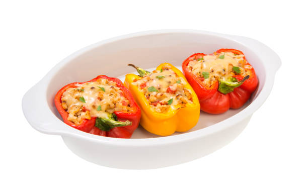 istock baked with cheese, stuffed peppers with minced turkey and vegetables isolated on a white backgroundё 1170179996