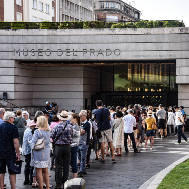 Crowds gather at the entrance to Museo del Prado, Madrid, Spain. Crowds gather at the Puerto de los Jeranimos entrance of the Museo del Prado museo del prado stock pictures, royalty-free photos & images