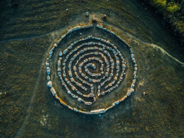 Spiral labyrinth made of stones, top view from drone.