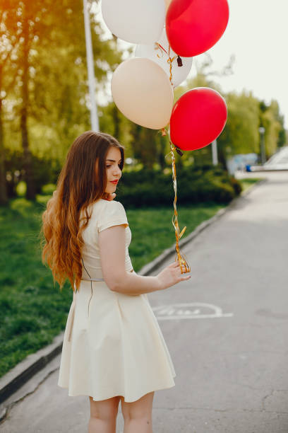 istock girl with ballons 1170185620