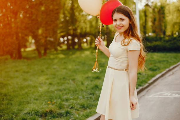 istock girl with ballons 1170185644