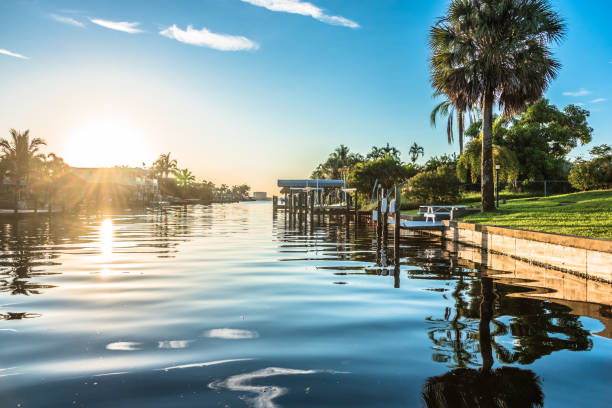 Sunrise over Canal Sunrise over canal fort myers photos stock pictures, royalty-free photos & images