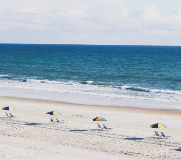 istock Beach Chairs and Umbrellas 1170187374
