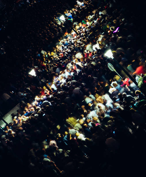 istock Dutch angle of long exposure of crowd at night - high perspective 1170187520
