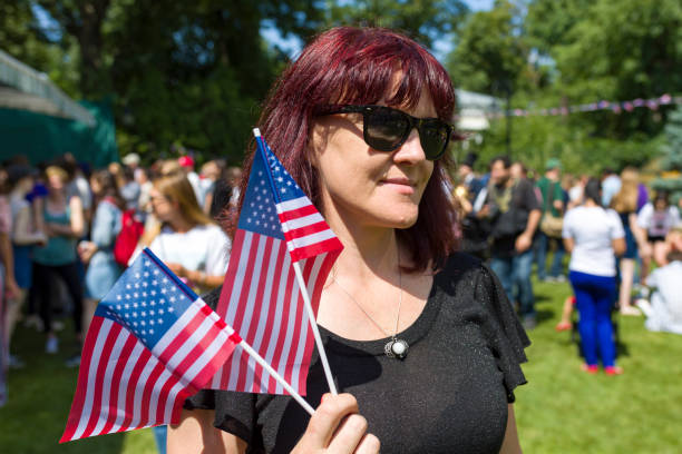 istock Woman with american flags in hands 1170192257