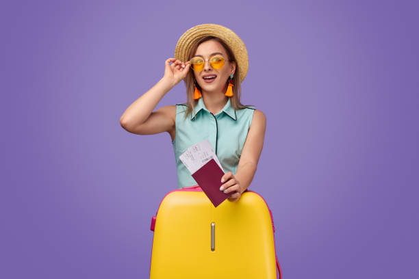 istock Stylish tourist with tickets and suitcase 1170192881