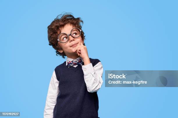 Thoughtful Little Genius Looking Up Stock Photo - Download Image Now - Child, Contemplation, Boys