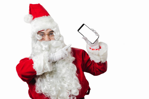 istock Santa Claus  showing smart phone on white blackground with copy space for text 1170193174