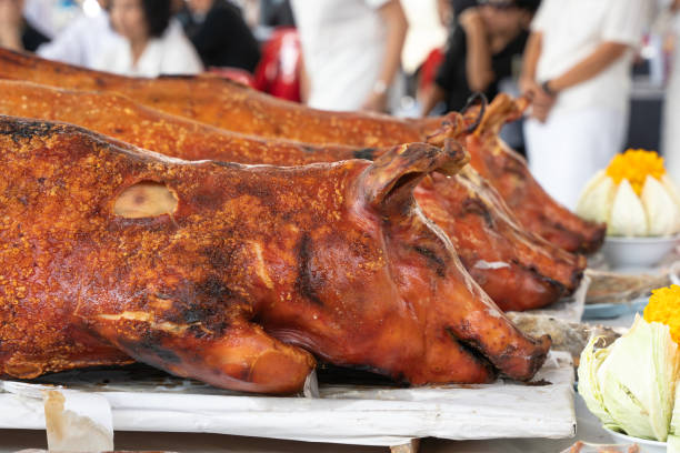 Pigs roast cooked over hot coals, grilled pig on the fire