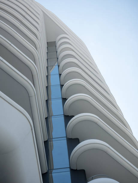 istock Abstract view on residential apartment complex building with many balconies and floors isolated against blue sky on sunny day 1170197132
