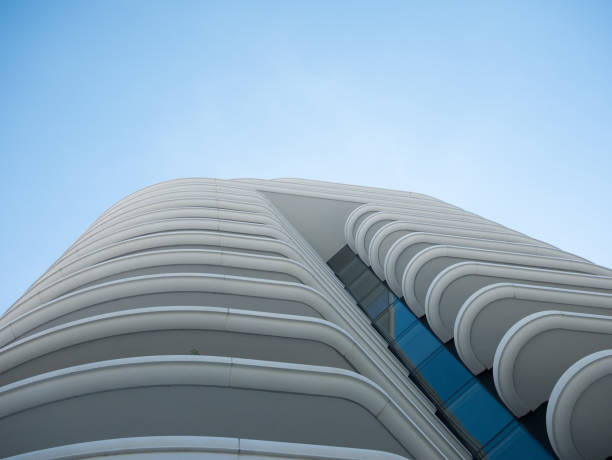 istock Abstract view on residential apartment complex building with many balconies and floors isolated against blue sky on sunny day 1170197140