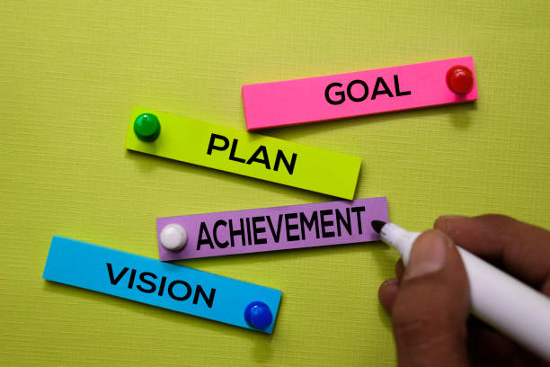 istock Goal, Plan, Achivement, Vision text on sticky notes isolated on green desk. Mechanism Strategy Concept 1170204104