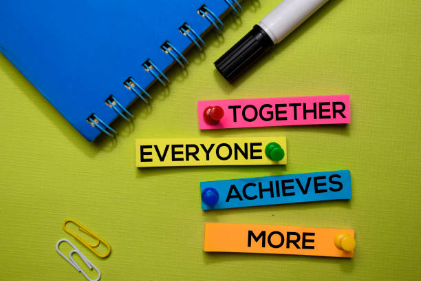 istock Together, Everyone, Achieves, More (TEAM) text on sticky notes isolated on green desk. Mechanism Strategy Concept 1170204116