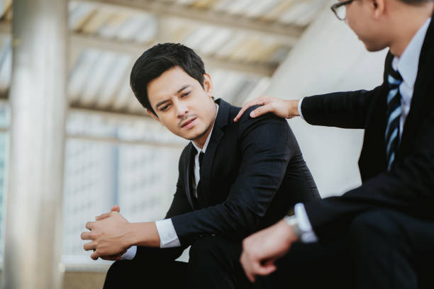 istock concept Burnout Syndrome. Businessman feels uncomfortable working. Which is caused by stress, accumulated from unsuccessful work And less resting body. Consult a specialist psychiatrist. 1170209230