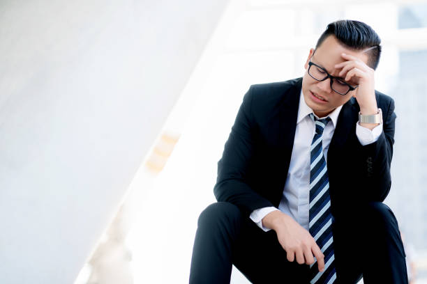 istock Concept Burnout Syndrome. Businessman feels uncomfortable working and being unemployed. Which is caused by stress, accumulated from unsuccessful work And less resting body. Consult a specialist 1170209268