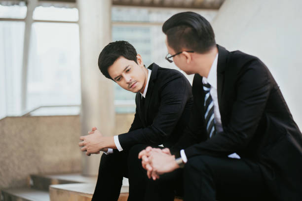 istock concept Burnout Syndrome. Businessman feels uncomfortable working. Which is caused by stress, accumulated from unsuccessful work And less resting body. Consult a specialist psychiatrist. 1170209279