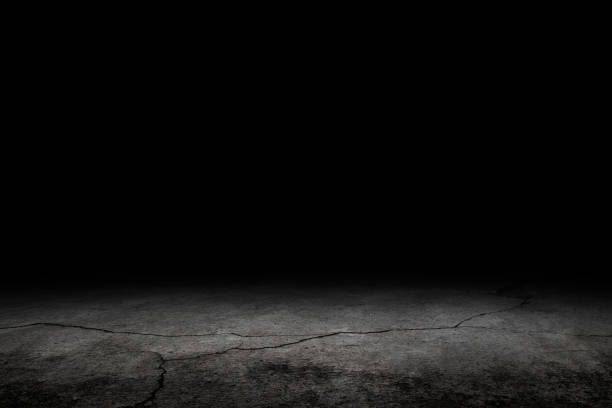 istock Crack concrete floor with dark background 1170211589