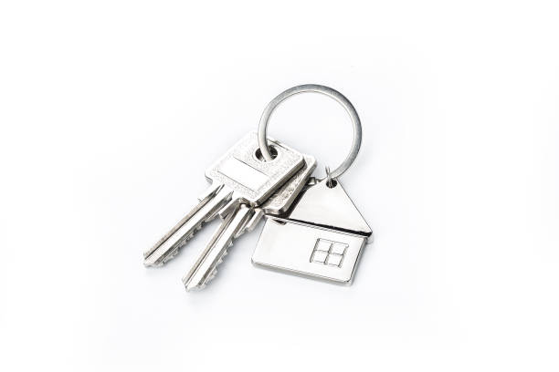 istock Key placed on top of white backgroundPurchase concept 1170218106