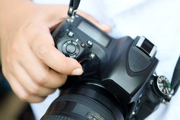 istock female tourist photographer is check her digital camera and setting. 1170219293
