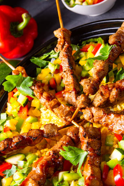 istock Lamb skewers with curry rice and different vegetables 1170221270