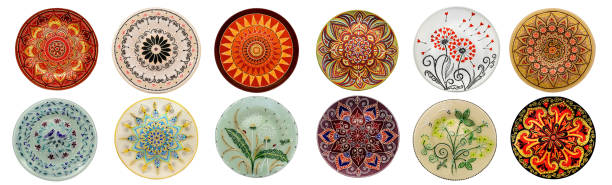 istock Set of decorative ceramic dishes hand-painted with acrylic paints floral pattern isolated on white background 1170223649