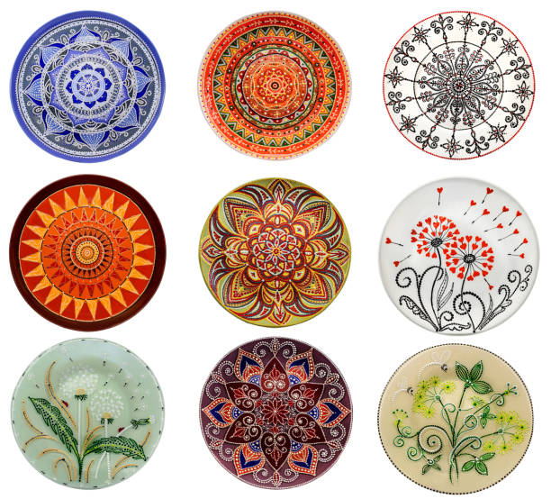 istock Set of decorative ceramic dishes hand-painted with acrylic paints floral pattern isolated on white background 1170223650