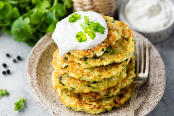 istock Zucchini fritters or pancakes with sour cream 1170224268