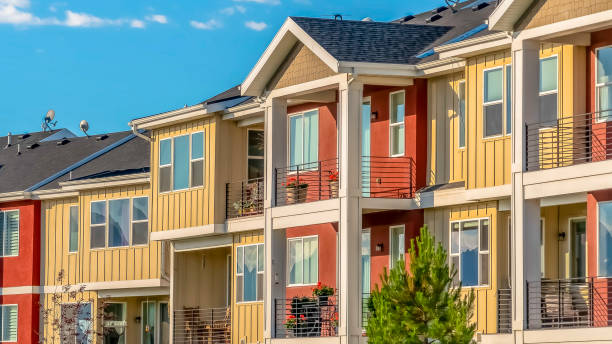istock Panorama frame Lovely townhomes viewed against blue sky background on a sunny day 1170226295