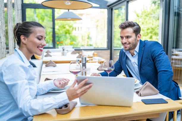 istock Coworkers working in restaurant and using laptop 1170228987