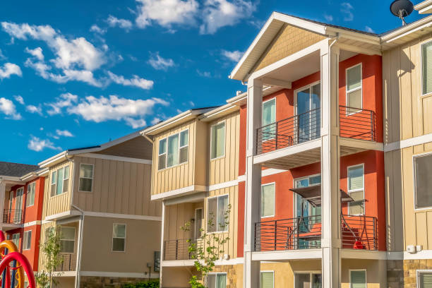 istock Facade of multi storey homes with orange and white exterior wall sections 1170229037