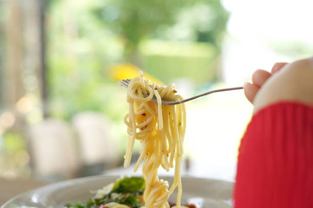 istock The Women holding Show a spaghetti 1170233419