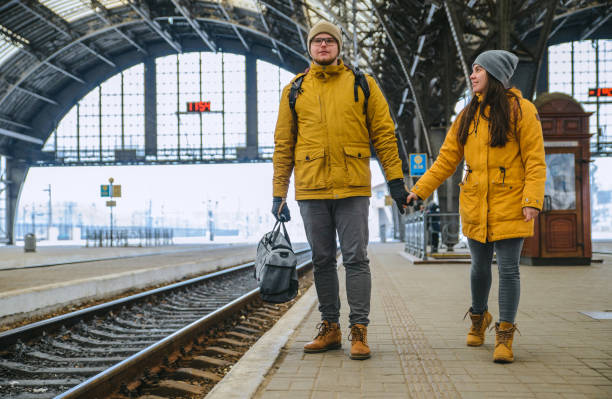 istock couple at railway station wiring for train 1170236080