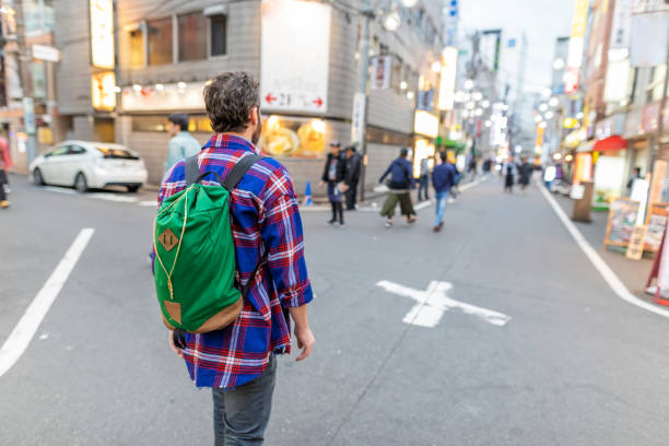 istock Male Backpacker Walking in Tokyo 1170238933