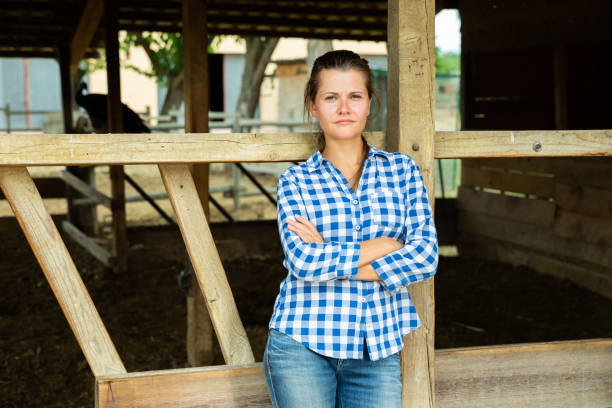 istock Tired farm worker stands near the corral 1170240028