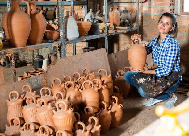 istock Female potter in pottery studio 1170240162