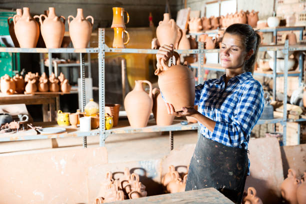 istock Female potter in pottery studio 1170240169