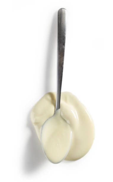 istock spoon of melted white chocolate 1170240183