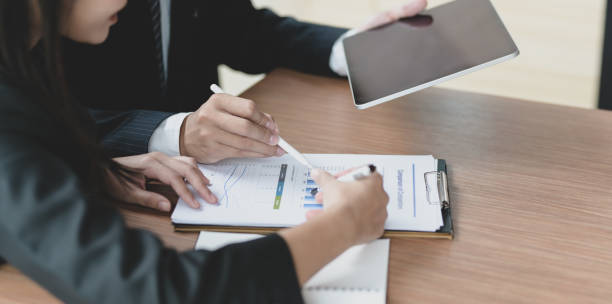 istock Young business partner discussing the project together 1170240297