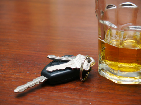 a glass of beer and car keys.
