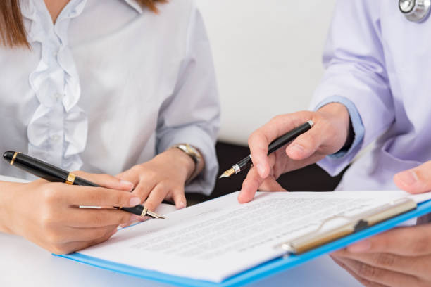 istock Doctor consulting patient hands closeup 1170241074