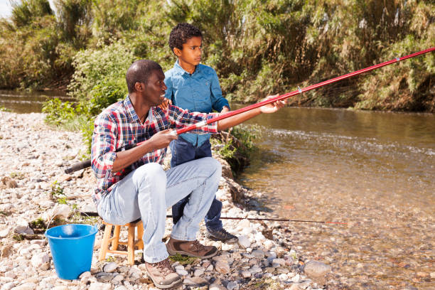istock Man and his son fishing 1170241270