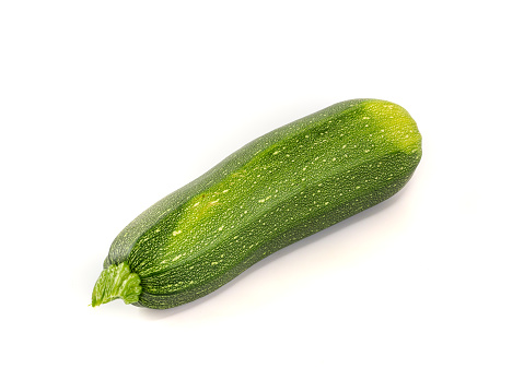 Fresh zucchini isolated on white background. Big green zucchini with shadow and copyspace for text.