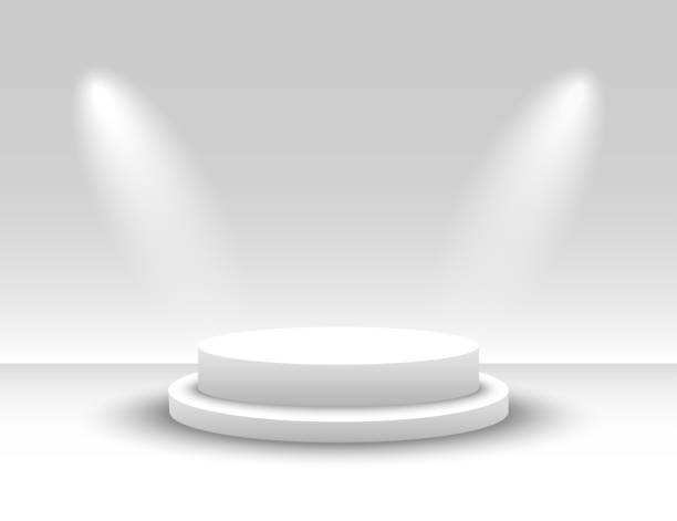 istock White Round Podium. White Round Pedestal. Winner podium illuminated by spotlights. Scene. Vector 1170243442
