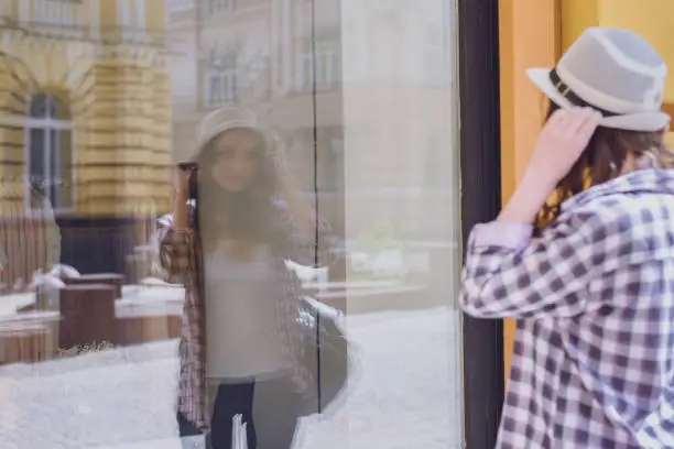 Photo of Hanger first hairdresser people person concept. Close up portrait of beautiful pretty smiling charming attractive lady looking at the reflection wearing white summer hat and pink violet jeans shirt