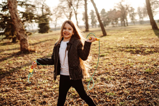 istock Girl playing with a jump rope 1170243910