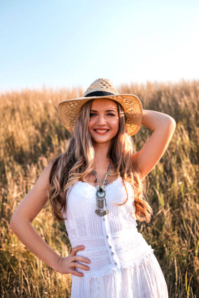 istock Beautiful woman enjoying nature outdoors at sunset. 1170247174