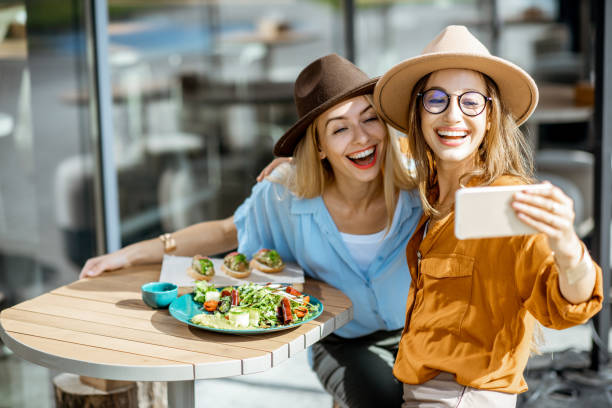istock Girlfriends eating healthy food on a terrace 1170247629