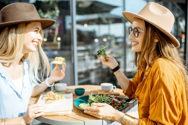 istock Girlfriends eating healthy food on a terrace 1170247630
