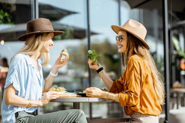 istock Girlfriends eating healthy food on a terrace 1170247640